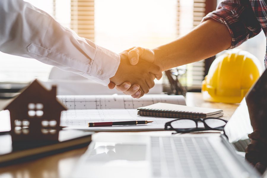 Specialized Business Insurance - Client Shaking Hands with Contractor